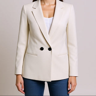 Woman wearing a Blake Stone Ruched Sleeve Blazer over a white shirt with a plain background